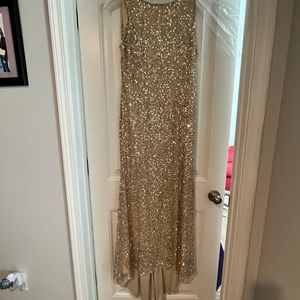 Sequin gown with a train. Beautiful gold and rose gold sequins. Size 12.